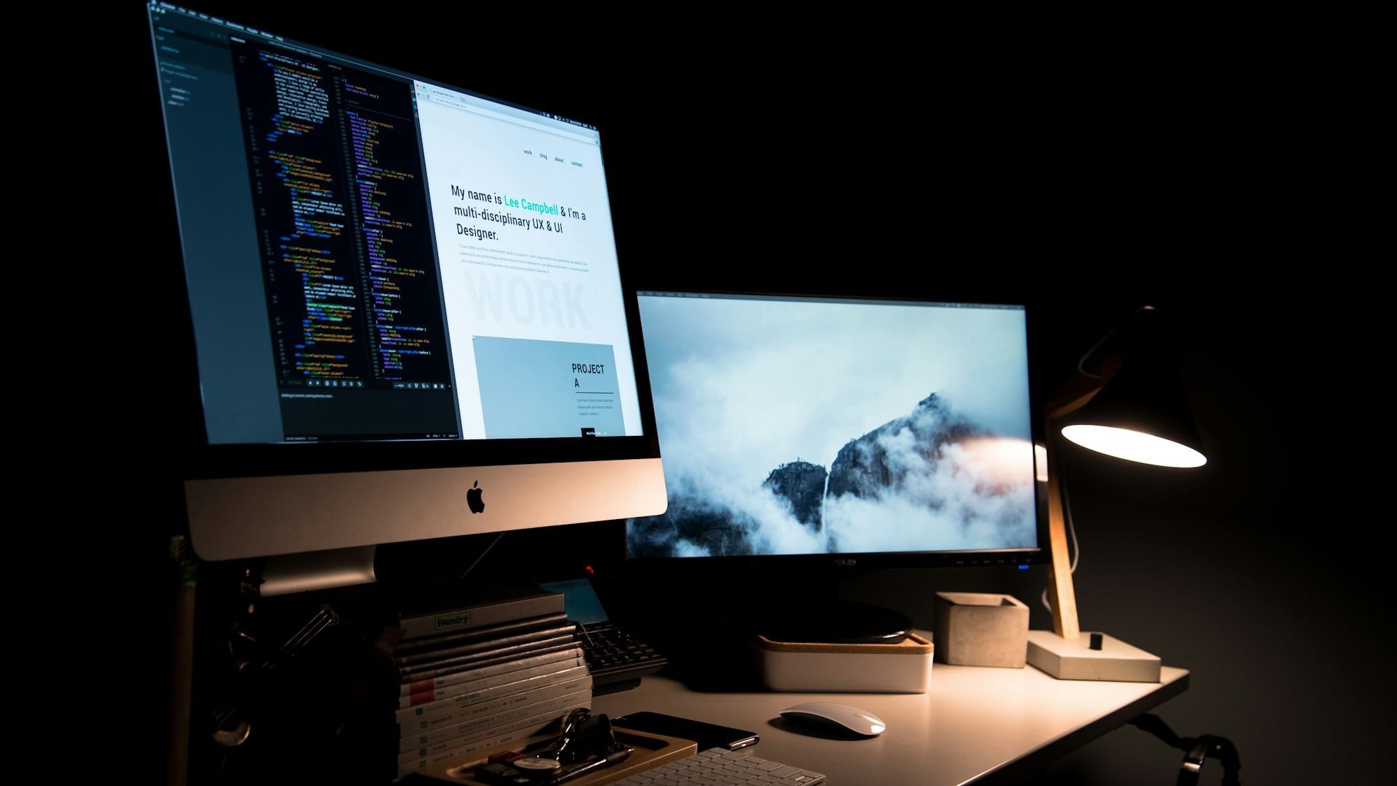 silver iMac turned on inside room